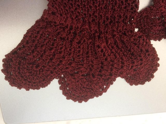 Preview of the first image of Ladies burgundy coloured vintage crotchet gloves.