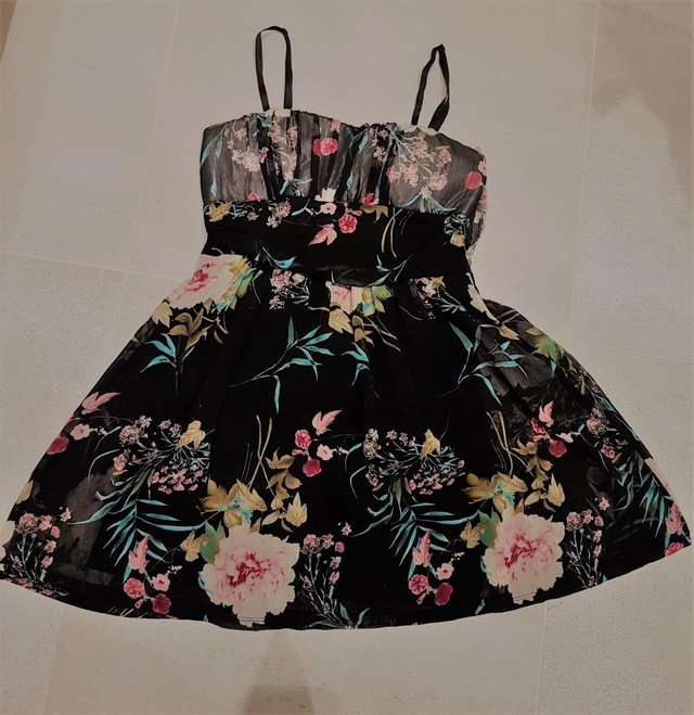 Preview of the first image of Beautiful, elegant Floral Party Dress with black background..