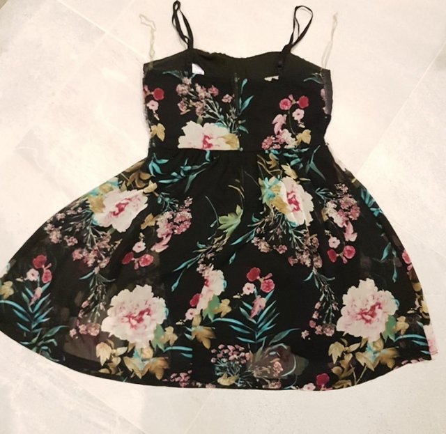 Image 2 of Beautiful, elegant Floral Party Dress with black background.