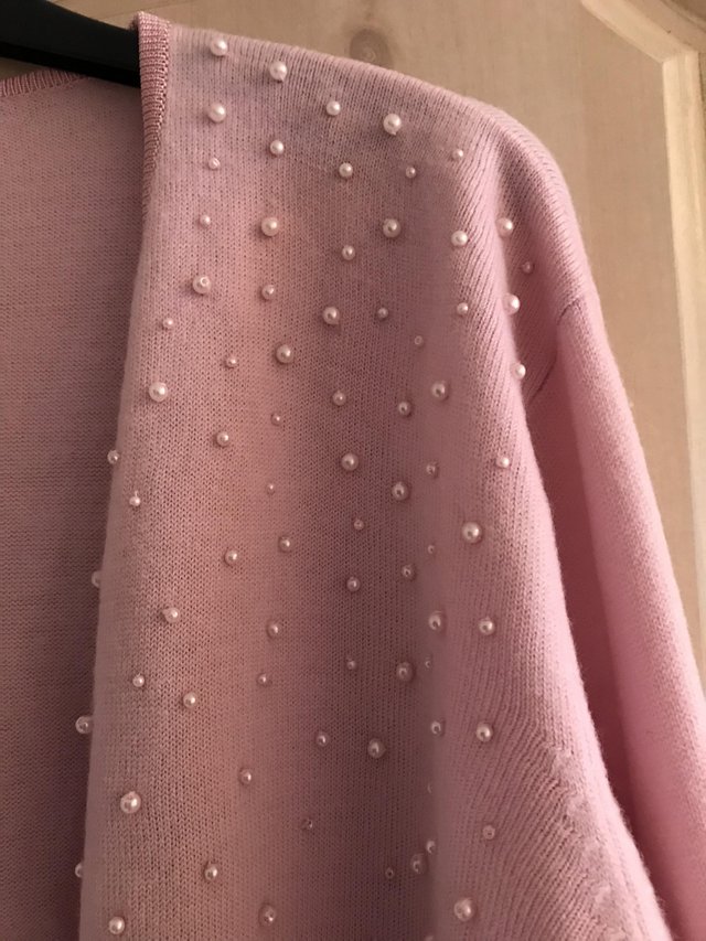 Preview of the first image of New Illusions Soft Pink Cardigan with Pretty Pink Pearls.