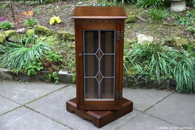 Preview of the first image of OLD CHARM LIGHT OAK REVOLVING CD STORAGE CABINET STAND UNIT.