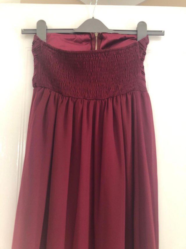 Preview of the first image of Maia Hemera burgundy Maternity dress.
