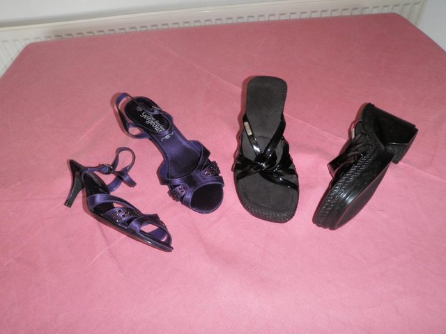 Preview of the first image of Black Kickers Sandals and New Look Purple High Heels.