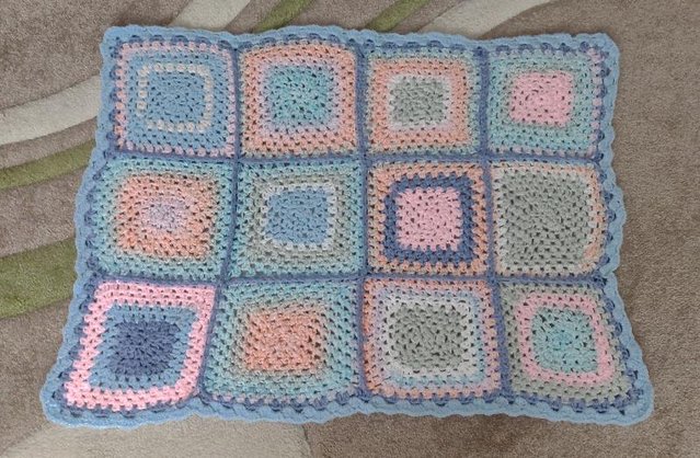 Preview of the first image of Beautiful Hand Crocheted Patchwork Baby Blanket.    BX12.