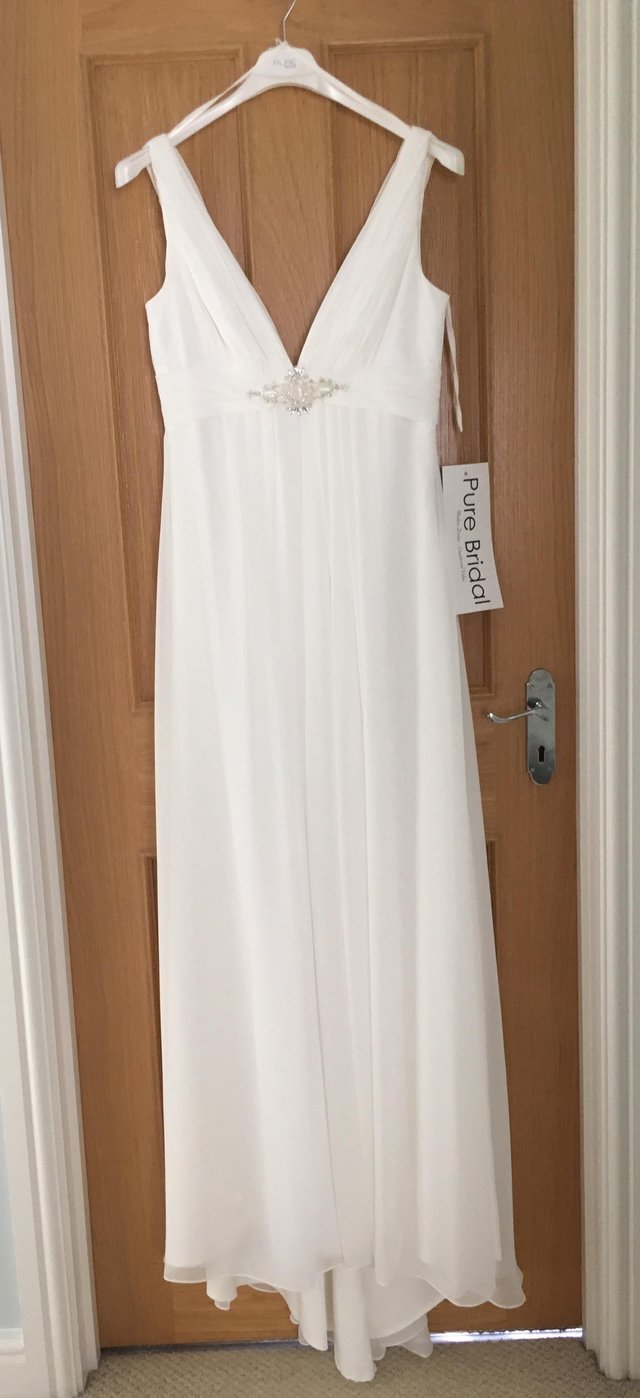 Preview of the first image of Ivory Empire Line Wedding Dress, Size 12, Brand New with Tag.