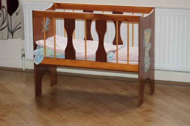 Preview of the first image of Dolls cot with bedding doll not included.