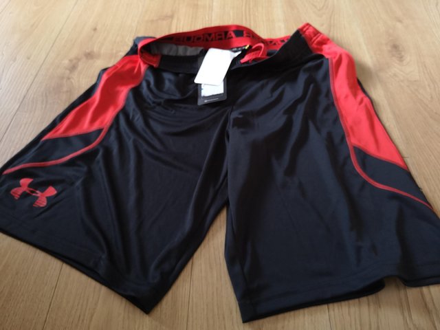 Preview of the first image of Under Armour YXL heat gear shorts.