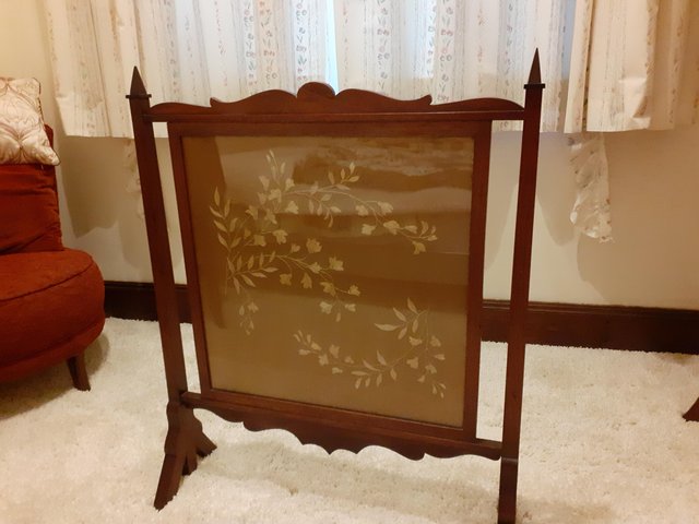 Preview of the first image of Antique silk embroidered glass and mahogany firescreen.