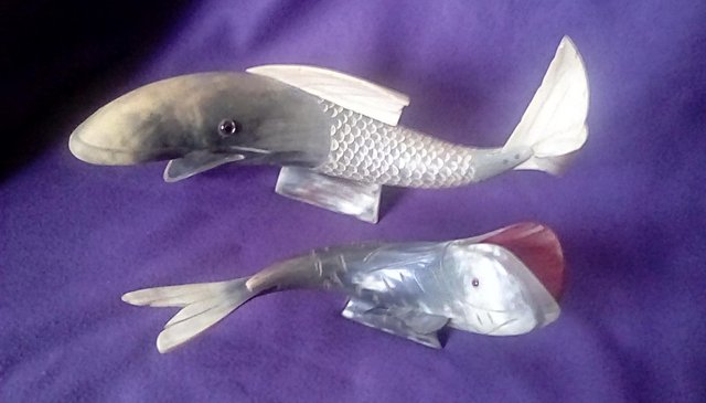 Preview of the first image of Carved Horn 2x Fish with Stand.