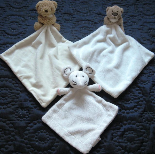 Preview of the first image of Snuggle cloths and Baby toys..