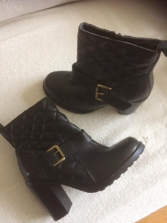 Preview of the first image of faith Ladiesblack ankle boots.