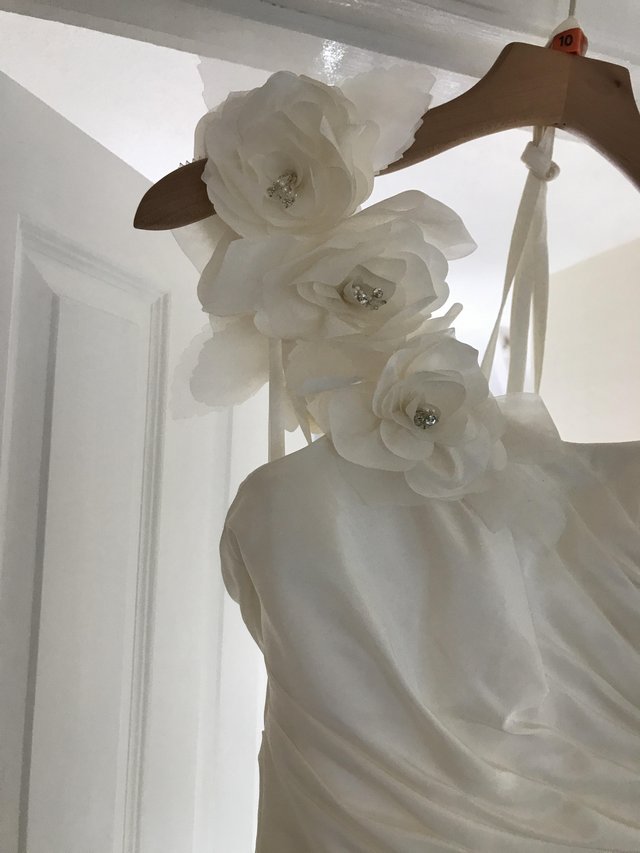 Preview of the first image of Phoenix gowns wedding dress never worn.