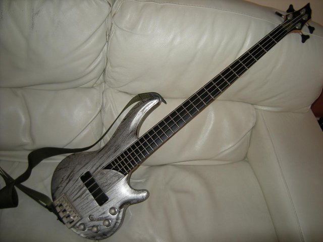 Preview of the first image of Cort Curbow 4 Bass Guitar Streaky Silver.
