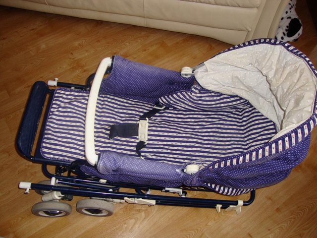 Preview of the first image of Child's (Buggy) pram with rain cover  excellent condition.