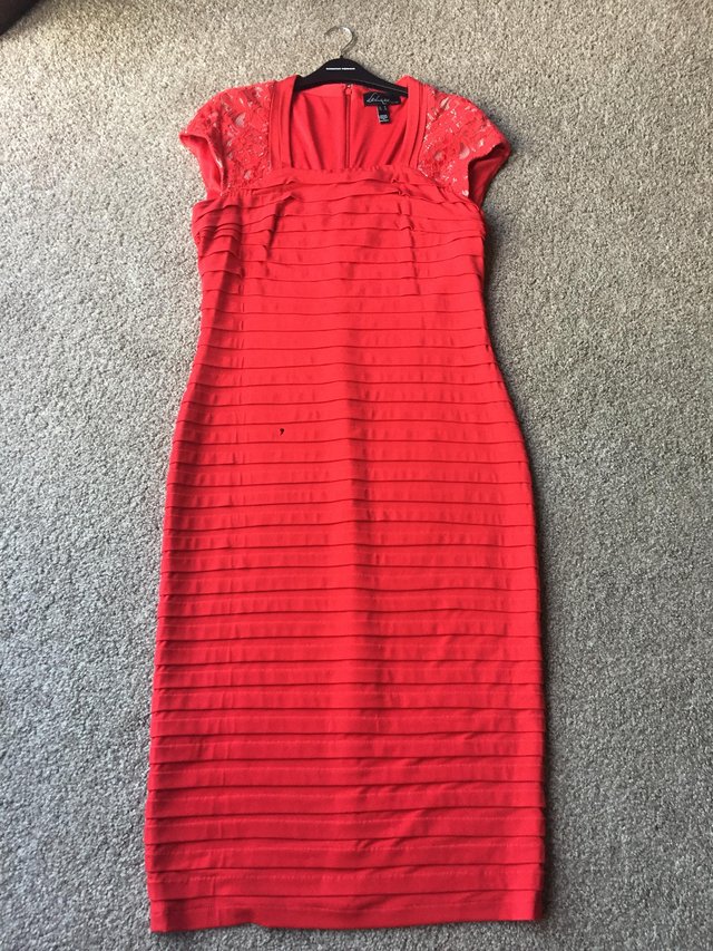 Preview of the first image of Tall red bodycon dress.