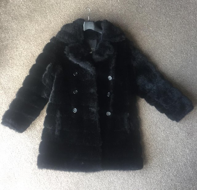 Preview of the first image of Faux fur black coat.