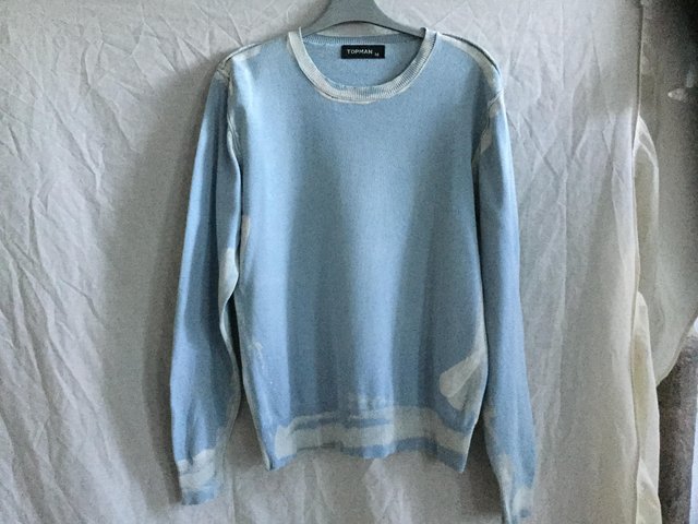 Preview of the first image of Baby blue paint splash effect jumper by Topman.