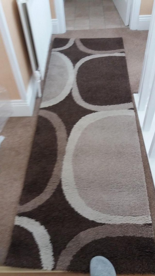 Preview of the first image of Brown And Cream Runner Rug Circular Pattern......