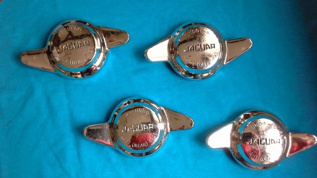 Preview of the first image of 4 x E-type Jaguar Original 2 Eared Chrome Wheel Spinners.