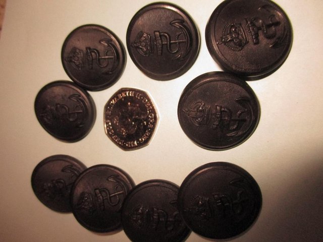 Preview of the first image of 9 Navy Kings Crown buttons Navy Bakelite.