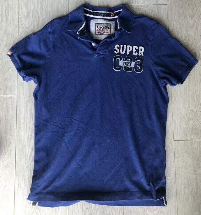 Preview of the first image of Superdry Blue Polo Shirt XL.