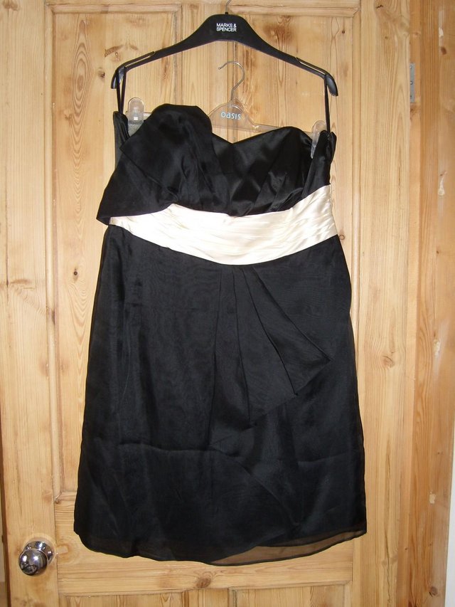 Preview of the first image of MONSOON Strapless Black Silk Mini Dress–Size 16.