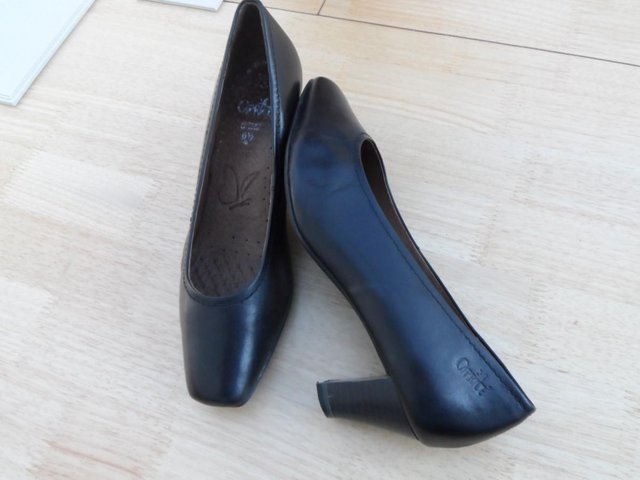 Preview of the first image of Ladies Black Leather Caprice Court Shoes.