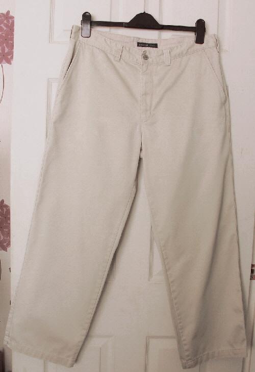 Preview of the first image of Lovely Men's Beige Trousers By Dockers - 34W/28L.