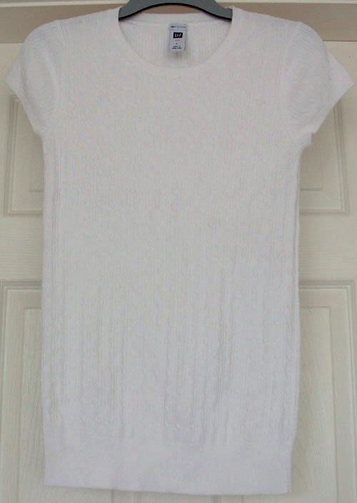 Preview of the first image of Lovely Ladies White Gap Short Sleeve Top - Size L.