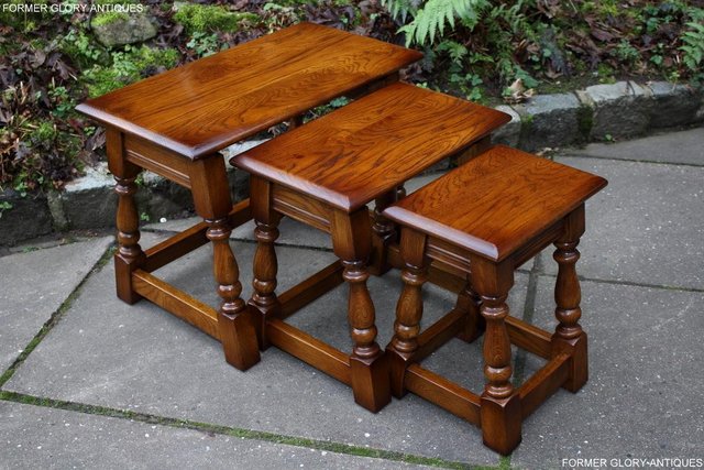 Preview of the first image of OLD CHARM LIGHT OAK NEST OF THREE COFFEE TEA SIDE TABLES.