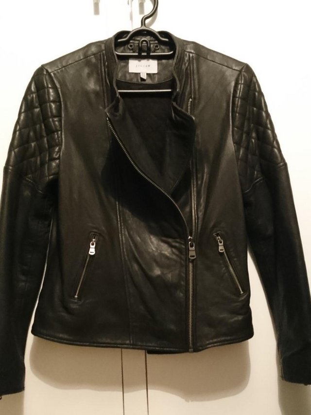 Preview of the first image of Jigsaw black ladies leather jacket.