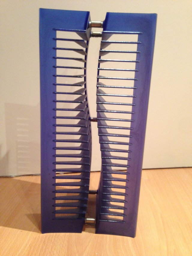Preview of the first image of Blue CD rack, in good condition.