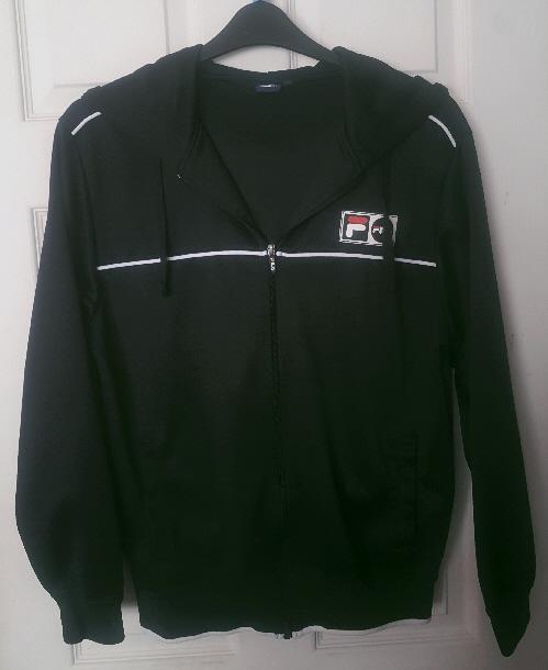 Preview of the first image of Smart Men's Black Hooded Jacket By Fila - Size M.