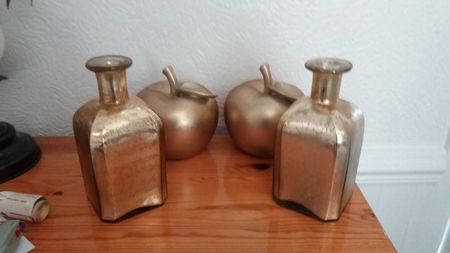 Preview of the first image of Two Gold Apples and Two Gold Vases.