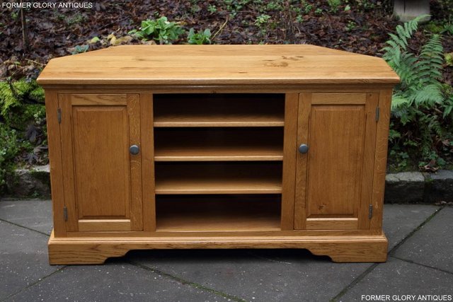 Preview of the first image of AN OLD CHARM NATURAL OAK CORNER TV DVD MEDIA CABINET STAND.
