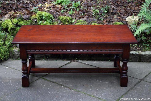Preview of the first image of AN OLD CHARM TUDOR BROWN CARVED OAK COFFEE TABLE TV STAND.