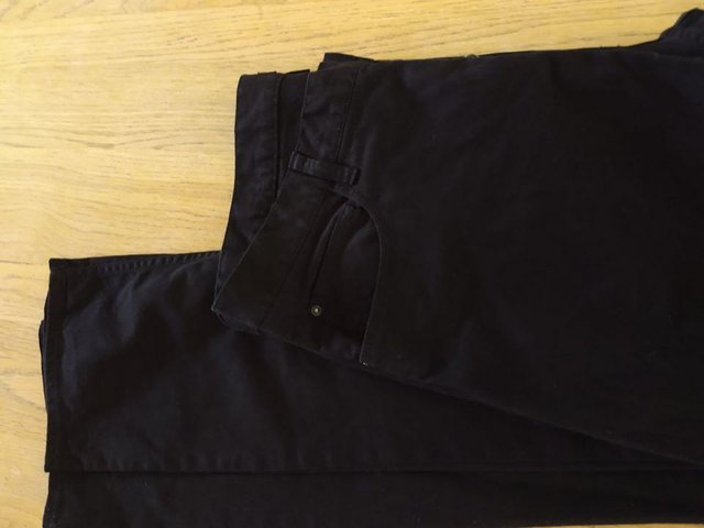 Preview of the first image of H&M black button up jeans EUR 33. LOOK NEW.