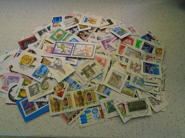 Preview of the first image of 500 + UK and international stamps on paper.