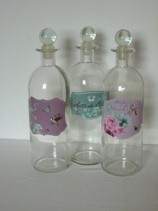 Preview of the first image of DUNELM Set 3 Glass Bathroom Bottles.