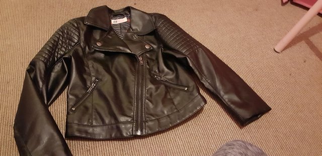 Preview of the first image of Girl leather look jacket age 7/8.