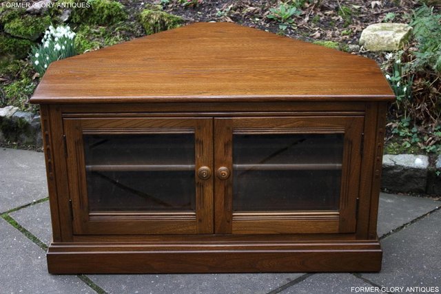 Preview of the first image of AN ERCOL GOLDEN DAWN CORNER TV CABINET DVD STAND TABLE UNIT.