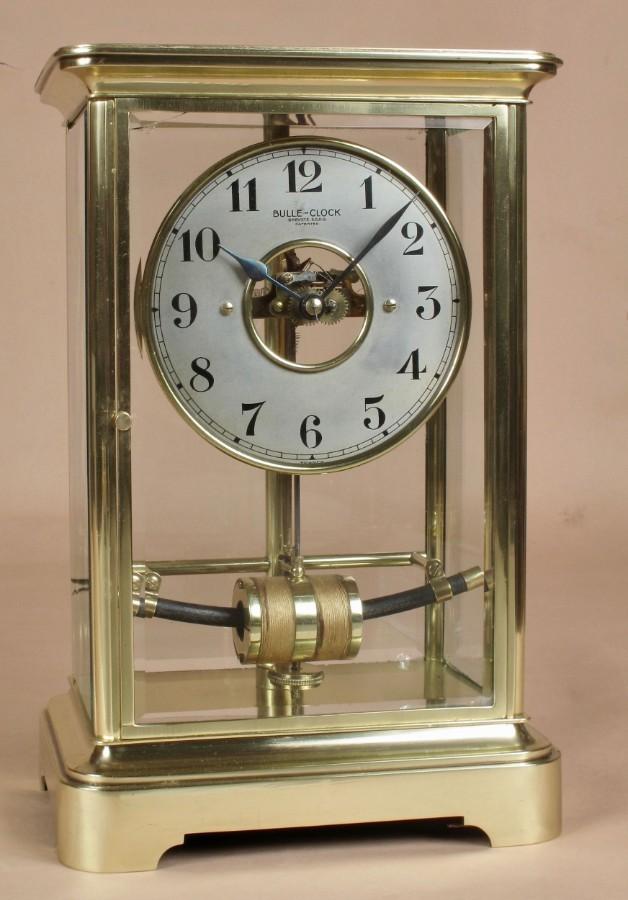 Preview of the first image of BULLE ELECTRIC FOUR SIDED GLASS AND BRASS CLOCK CIRCA 1910.