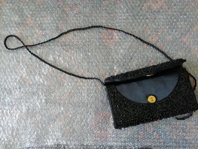 Preview of the first image of Black clutch/shoulder Bag.