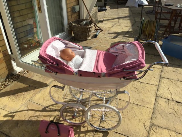 Preview of the first image of Silver cross dolls pram.