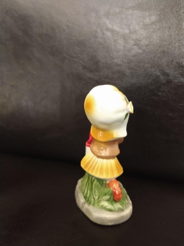 Image 2 of Porcelain Figurine Girl with Yellow Bonnet + bucket/pail.