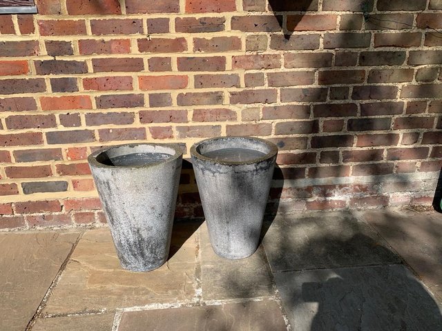Preview of the first image of 2 Black/dark grey granite stone conical plant pot holders.