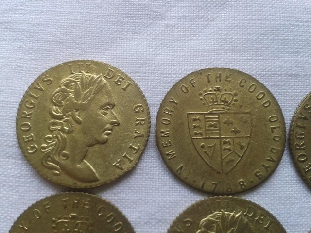 Preview of the first image of 9 x Antique brass gaming tokens featuring George III.
