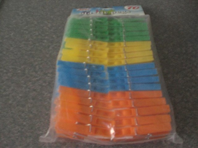 Preview of the first image of 70 Plastic pegs (Brand new packet).