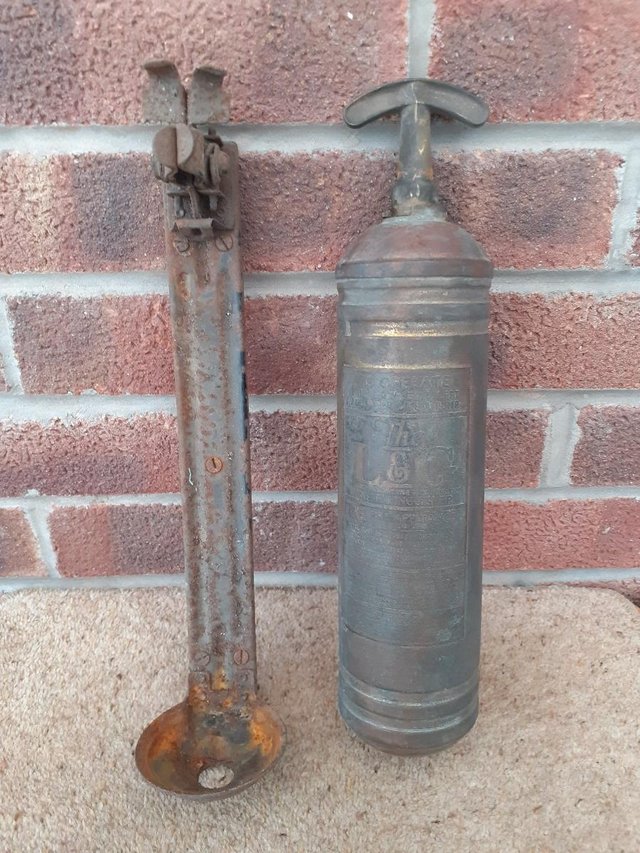 Preview of the first image of Antique L&G fire extinguisher with bracket.