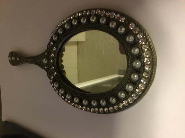 Preview of the first image of Vintage Hand mirror with pearl and stone encrusted surround.